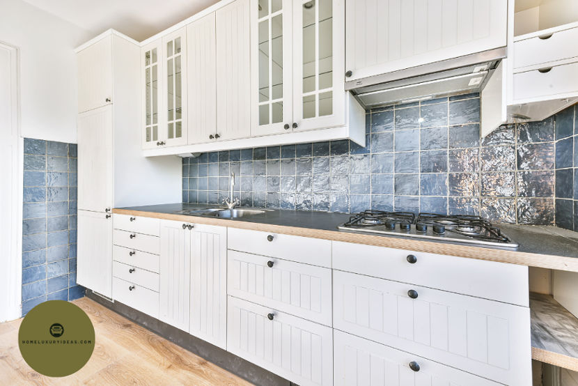 White Kitchen with Blue Pearl Granite Backsplash