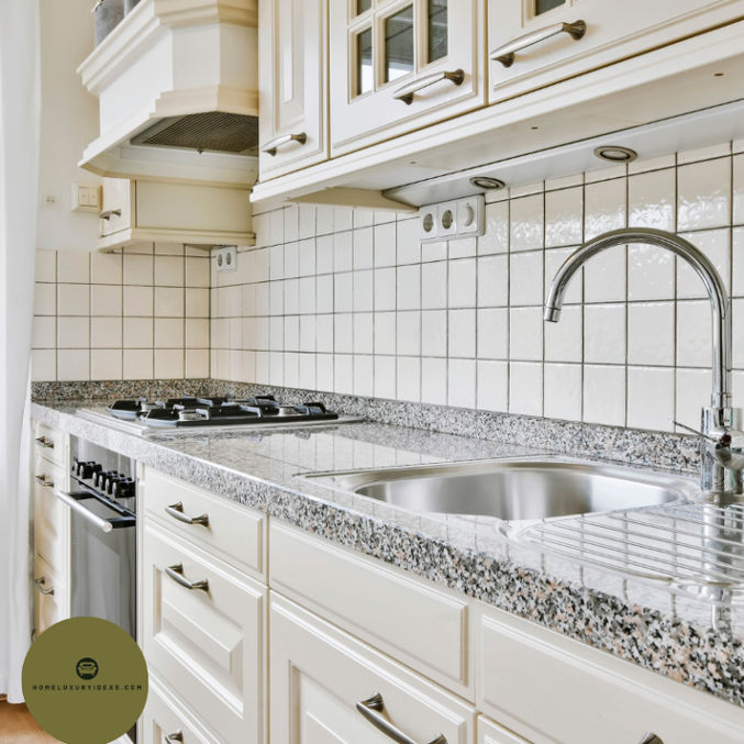 White Kitchen with Blue Pearl Granite Backsplash 