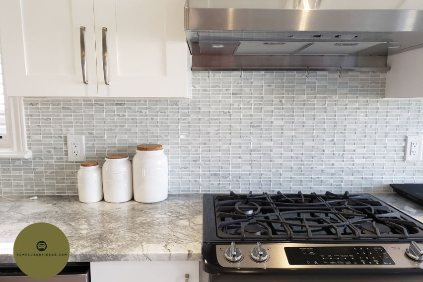 White Kitchen with Blue Pearl Granite Backsplash